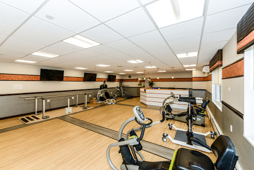 A well-equipped fitness center featuring exercise bikes and a clean, spacious layout.