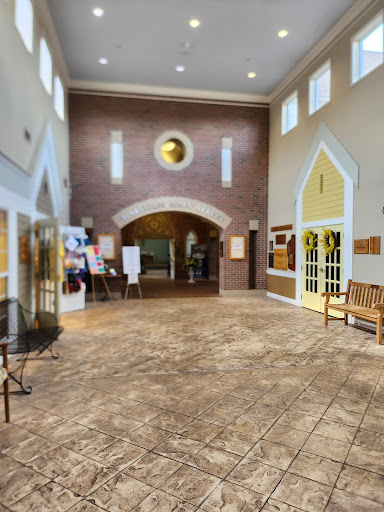 A spacious lobby featuring elegant architectural details and comfortable seating.