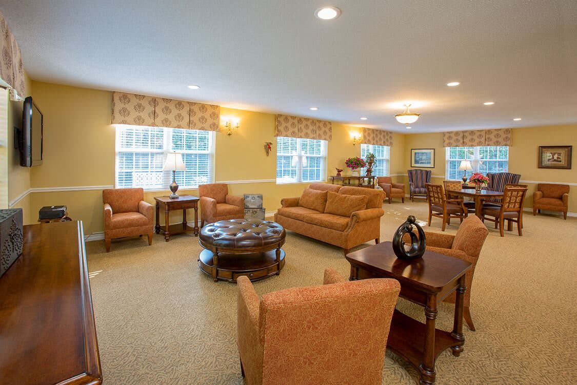 A cozy living room with comfortable seating and warm lighting.