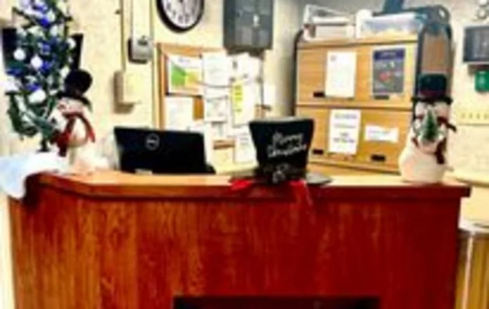 A festive hat decorates an office reception desk.