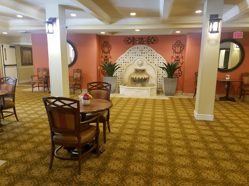 A cozy lobby featuring a decorative fountain and comfortable seating.