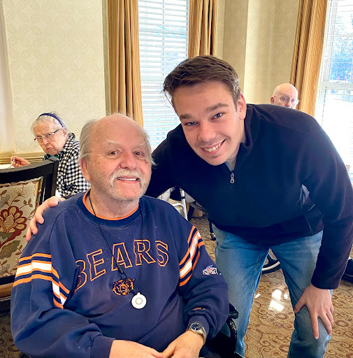 A joyful moment shared between two individuals in a care facility.