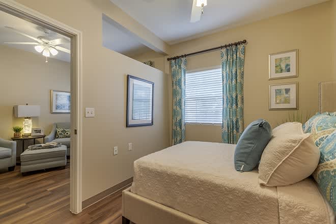 A modern bedroom with stylish decor and natural lighting.