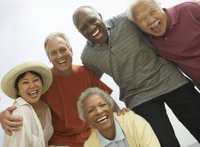A group of seniors enjoying a moment of laughter together.