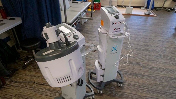 A set of medical machines used in a clinical setting for therapeutic purposes.