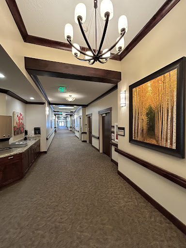 A well-designed hallway featuring elegant decor and artwork.