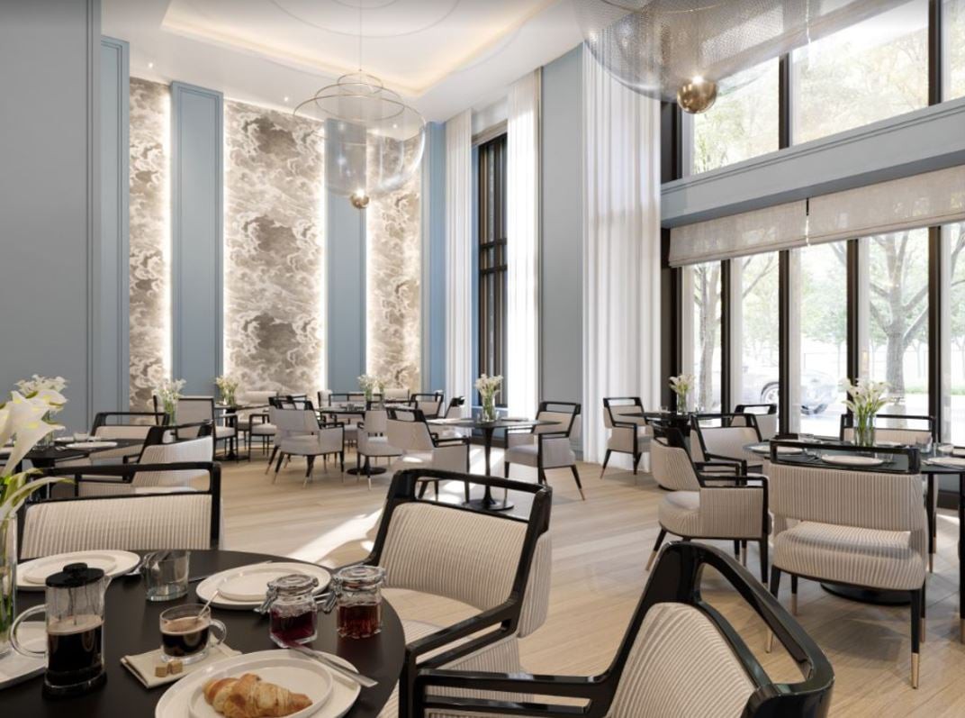 A modern and elegant dining area with ample natural light flooding through large windows.