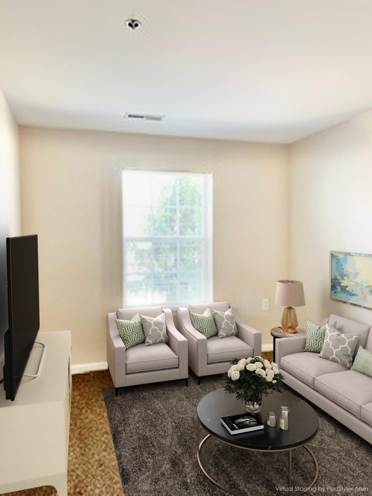 A cozy living room with a large window, stylish sofas, and a television.