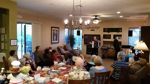 A lively gathering where guests enjoy music played on an accordion.