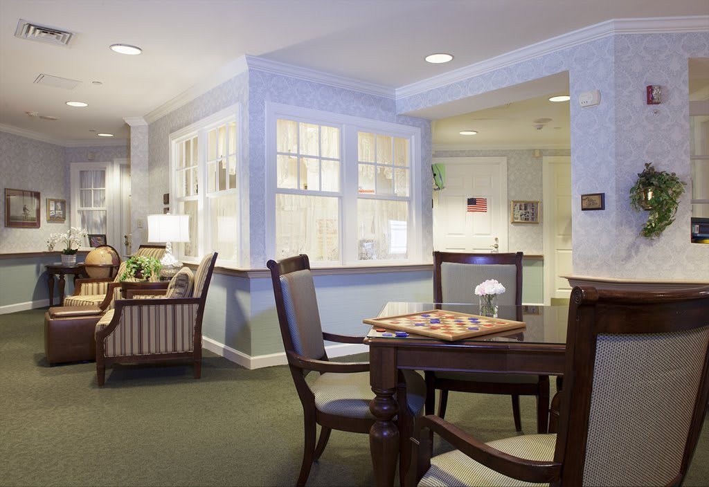 A cozy living and dining area with comfortable seating and warm lighting.