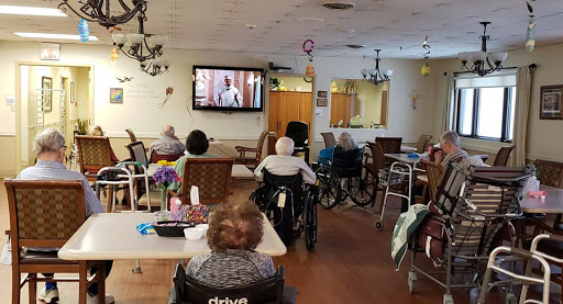Residents of a care home enjoying a movie together.