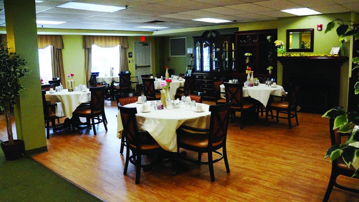 A well-decorated dining area with neatly arranged tables and chairs.