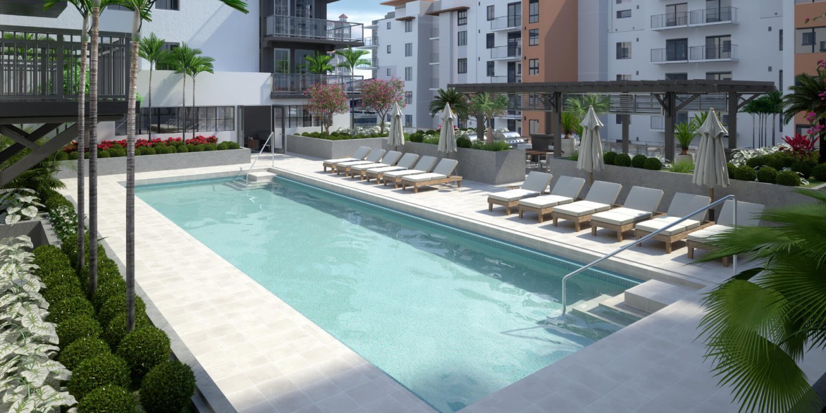 A modern apartment complex featuring an outdoor swimming pool with lounge chairs in an urban setting.