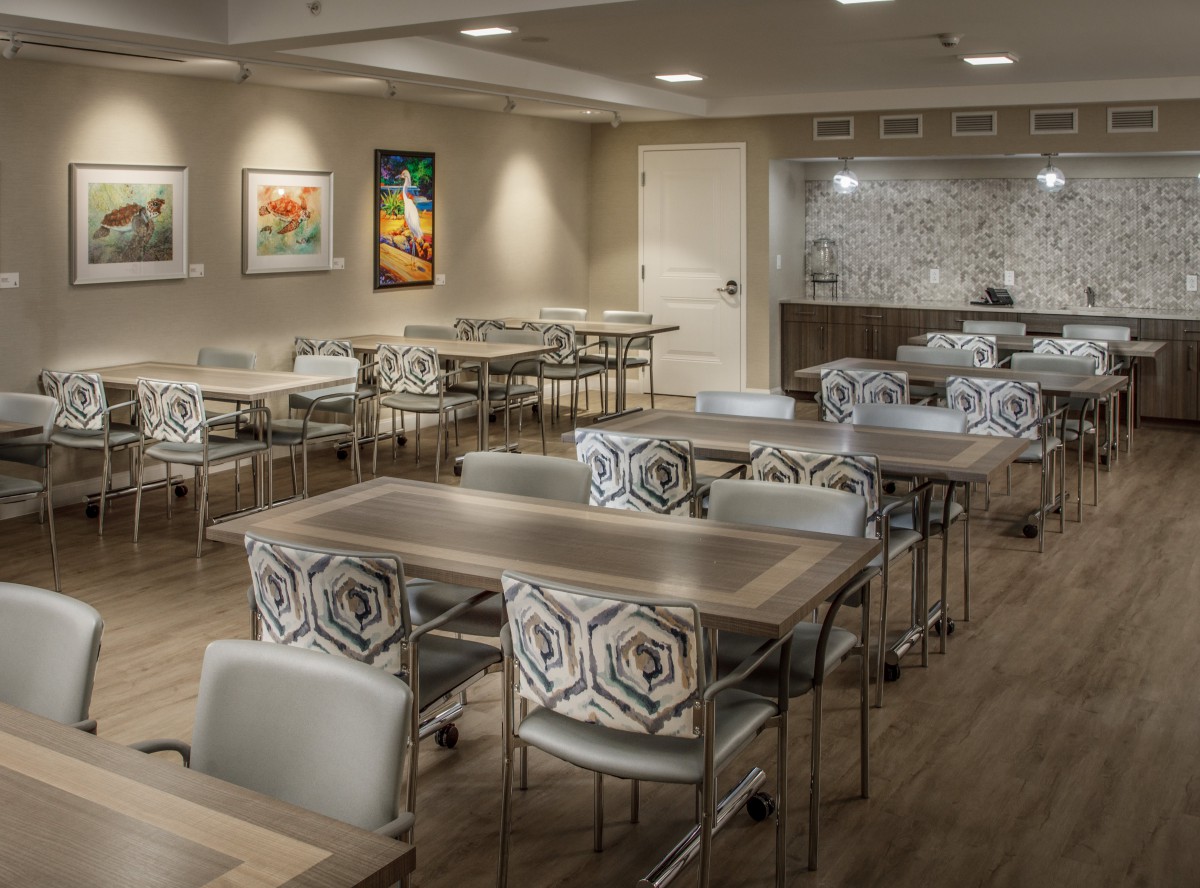 An empty conference room with modern decor and artwork on the walls.
