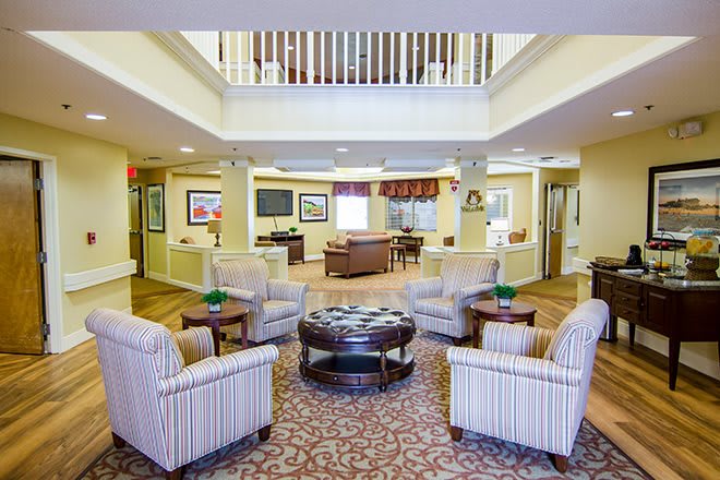 A well-furnished lobby featuring comfortable seating and a warm atmosphere.