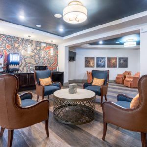 A stylish hotel lobby with comfortable seating and elegant decor.