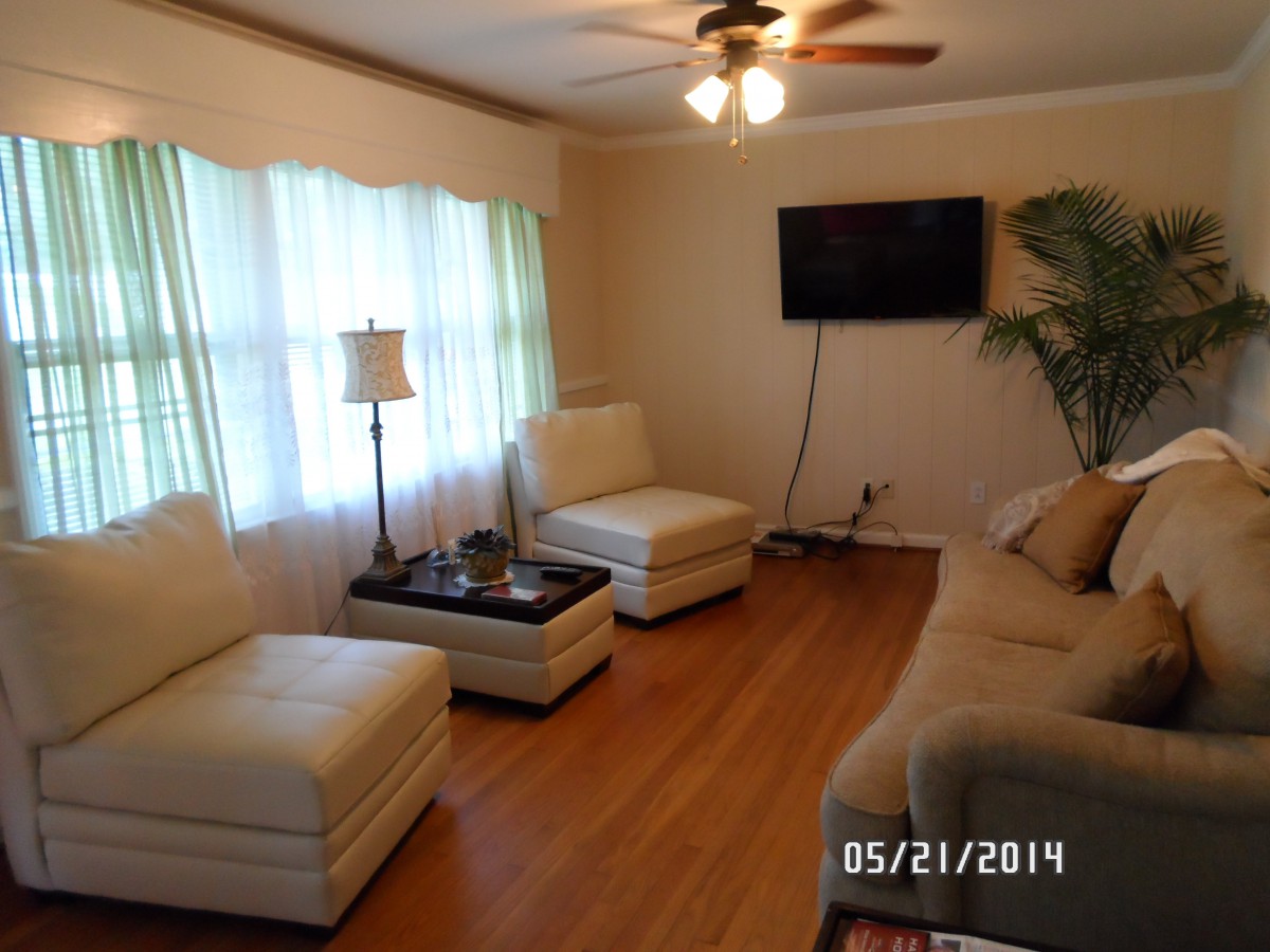 Images showing bedroom, windows, living room, television, plant, and more.