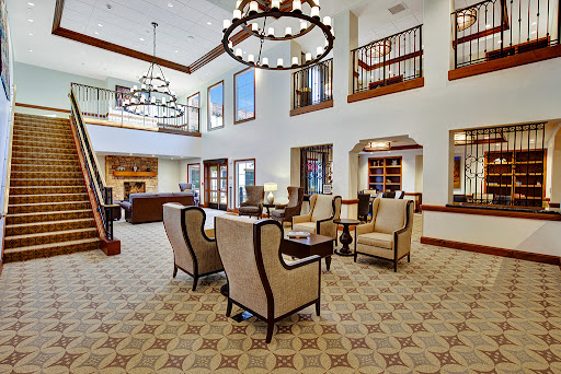 A bright and inviting lobby featuring elegant furnishings and stylish chandeliers.