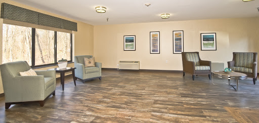 A spacious and welcoming lobby area featuring comfortable seating and modern decor.