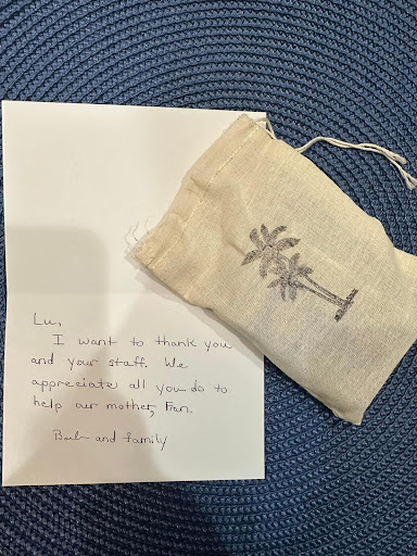A thoughtful thank you gift accompanied by a handwritten note, expressing gratitude.