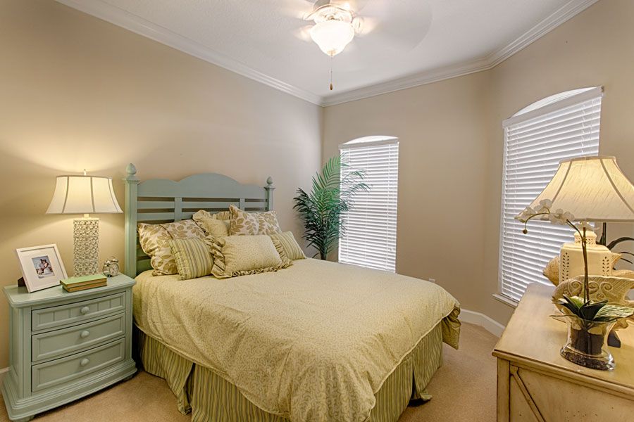A cozy bedroom with neutral tones and elegant decor.