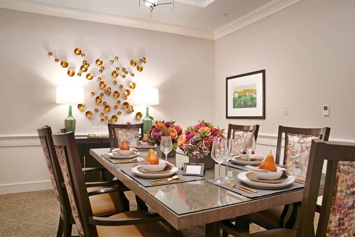 A beautifully set dining table with elegant decor and floral arrangements.