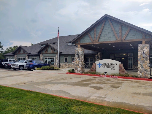 A modern medical facility with a welcoming entrance and landscaped surroundings.