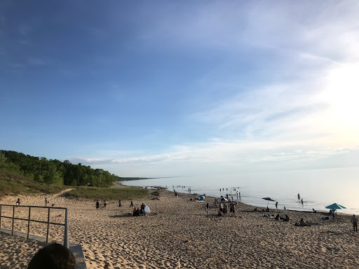 A serene beach scene with gentle waves and clear skies, perfect for a relaxing day outdoors.