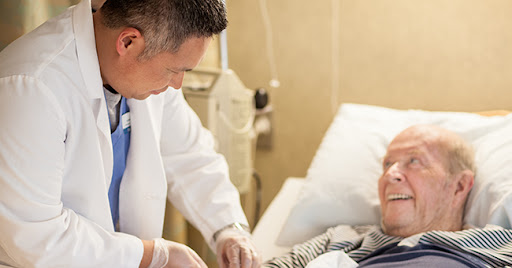 A doctor attending to a patient in a hospital setting.