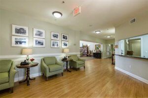 A cozy lobby area with seating and artwork on the walls.