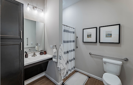 A contemporary bathroom featuring elegant fixtures and a minimalist aesthetic.