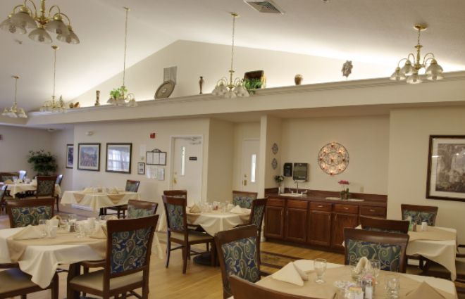 A well-decorated dining area with neatly arranged tables and chairs.