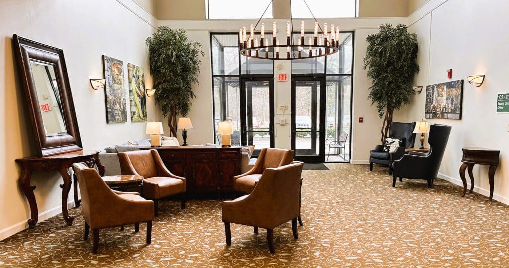 A well-appointed lobby with comfortable seating and a large chandelier.
