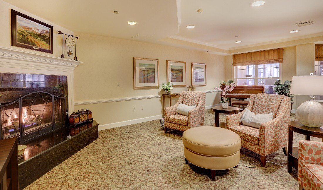 A cozy living room with comfortable seating and a fireplace.