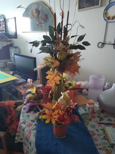 A beautiful autumn-themed floral arrangement bringing warmth and color to the room.