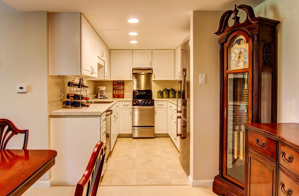 A modern kitchen with sleek appliances and stylish cabinetry.