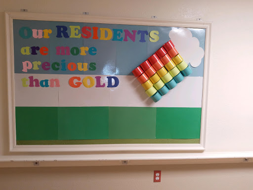 A cheerful bulletin board displaying a message that residents are more precious than gold.
