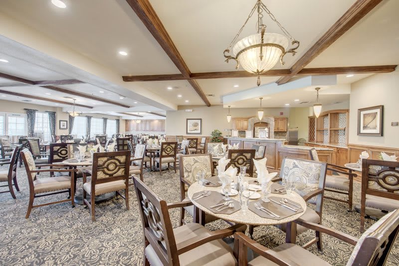 A well-decorated dining area with elegant lighting and comfortable seating arrangements.