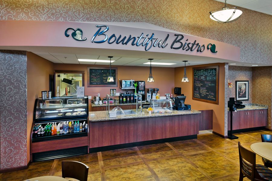 Interior view of a cafe named Bountiful Bistro, showcasing the counter and menu area.