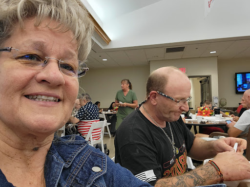A cheerful moment at a social gathering, capturing smiles and camaraderie.
