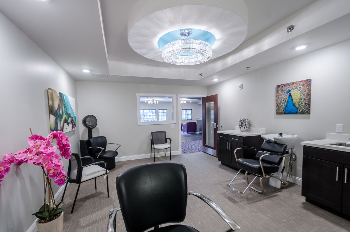 A modern salon interior with stylish seating and lighting.