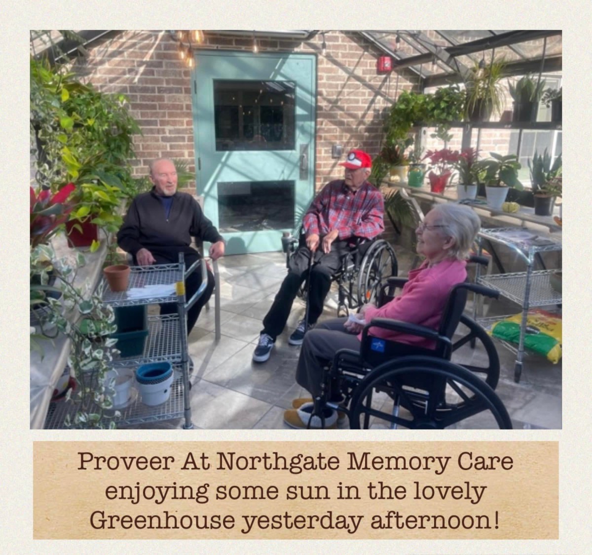 Residents of Northgate Memory Care enjoying a sunny afternoon in the greenhouse.