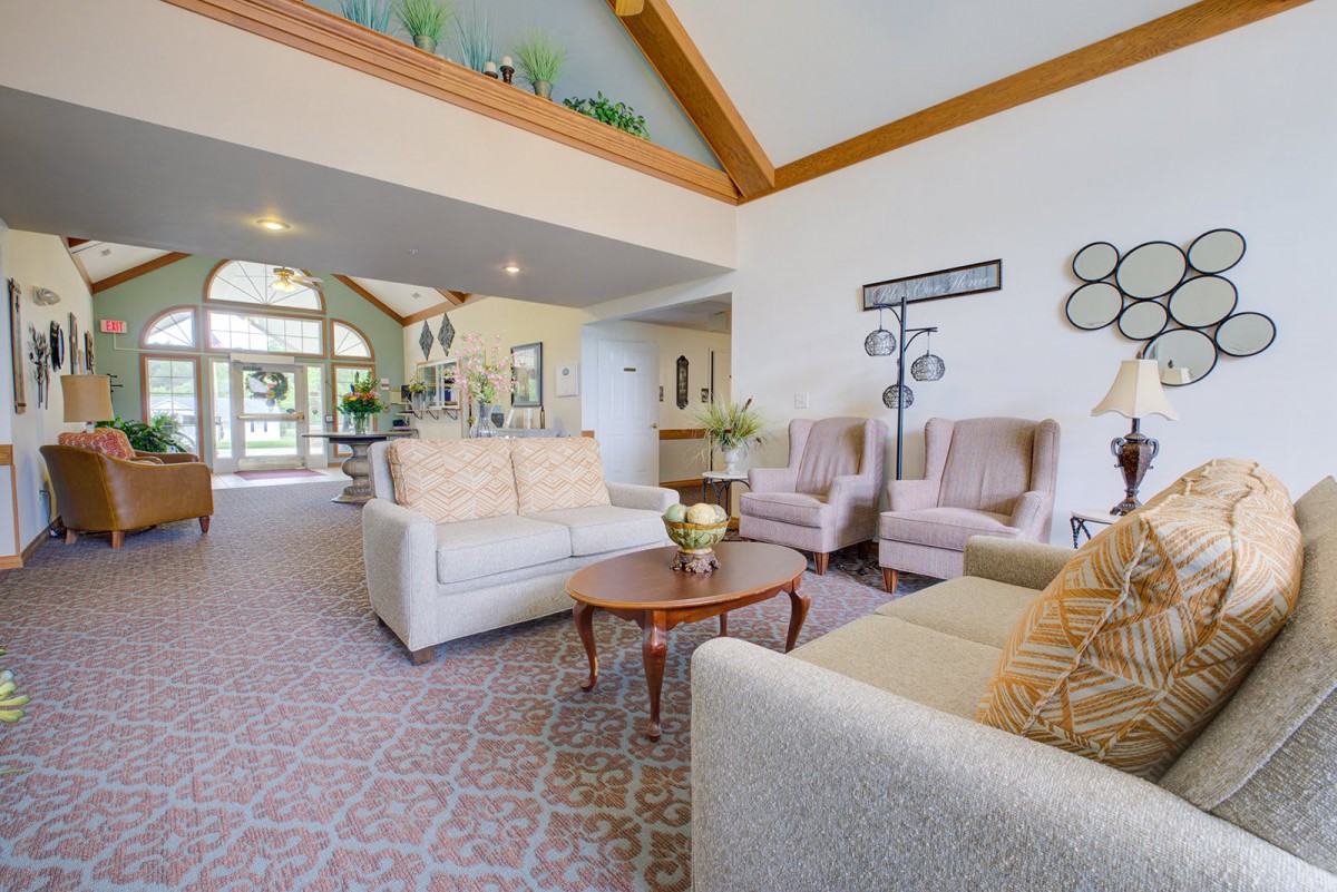 A spacious and bright living room with comfortable seating and elegant decor.