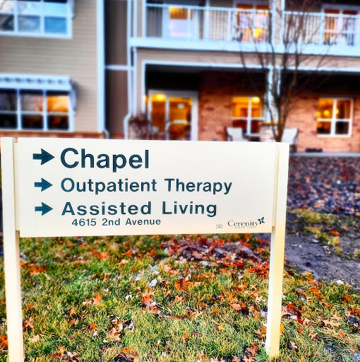A directional sign indicating the locations of the chapel, outpatient therapy, and assisted living services.