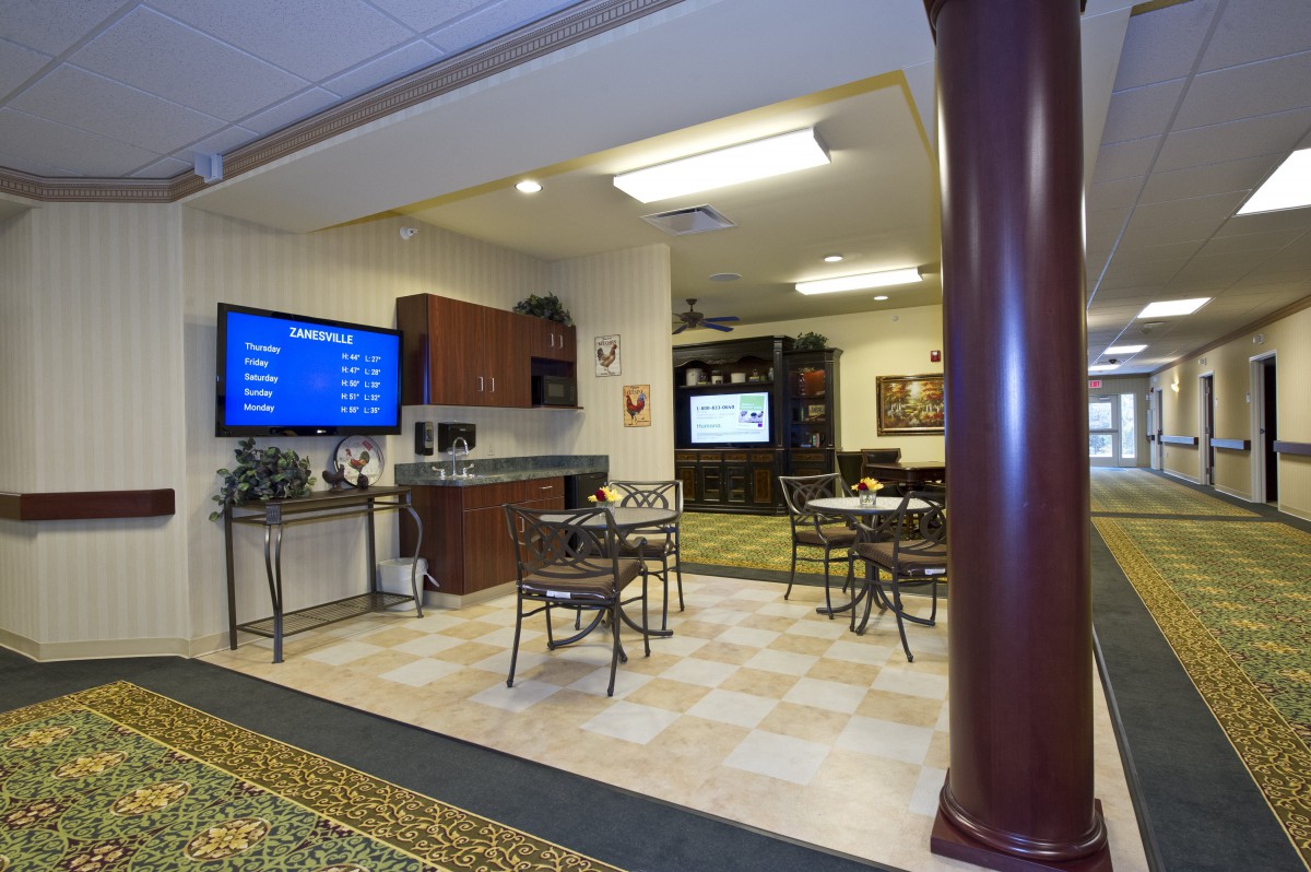 A comfortable waiting area with seating and television.