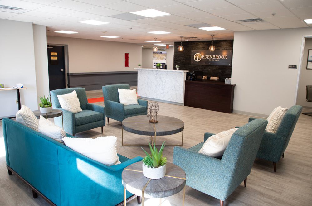 A modern lobby with comfortable seating and a reception desk.
