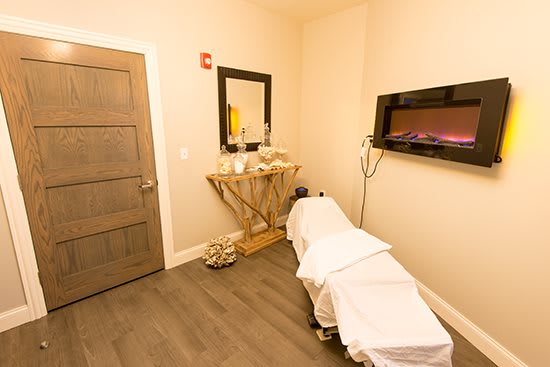 A tranquil spa massage room with a cozy atmosphere.