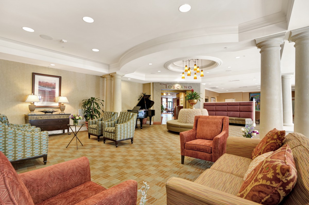 A spacious and elegantly designed lobby with comfortable seating and warm lighting.