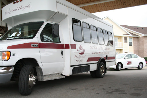 A white bus parked at a transportation hub.