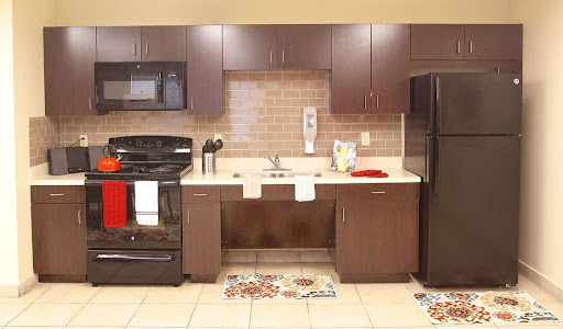 A modern kitchen featuring sleek appliances and a functional layout.